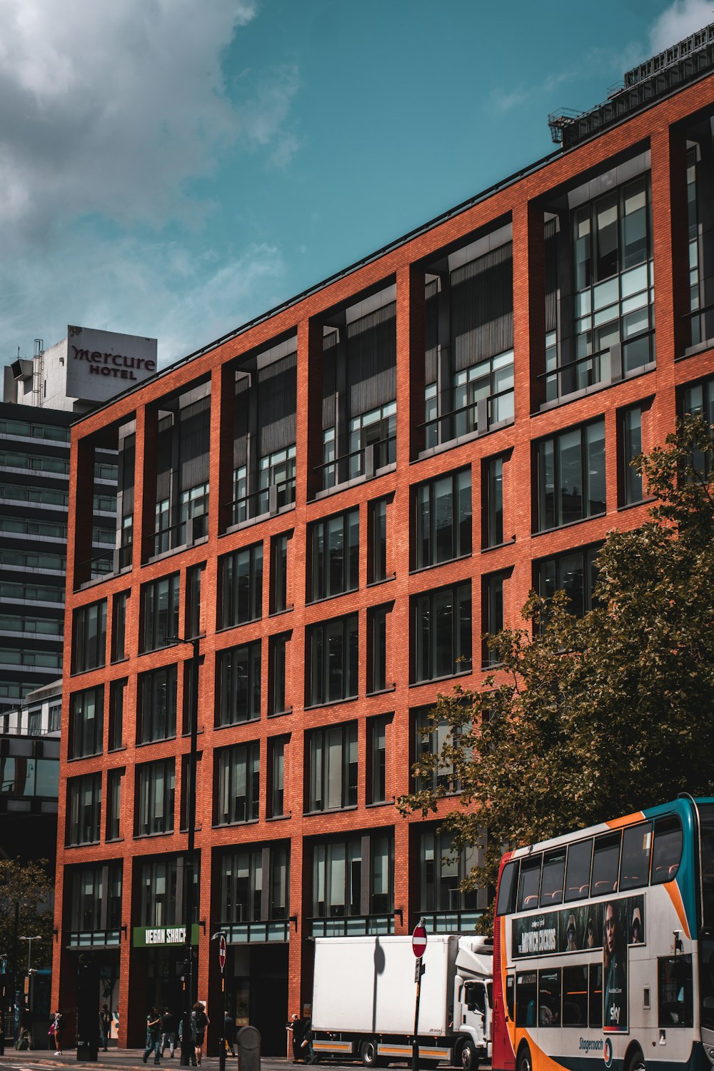 a double decker bus parked in front of a building