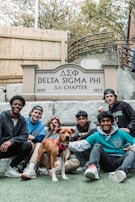 Historic black-and-white photo of the original Alpha Tau chapter members displayed alongside current members.
