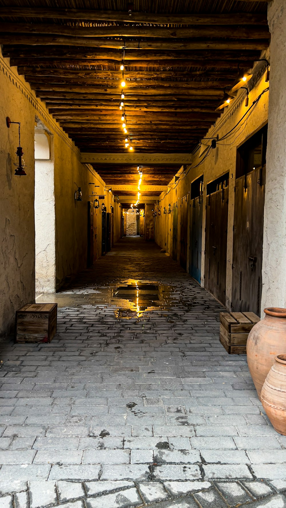 a long hallway with a water feature in the middle