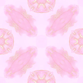 Elegant display of pastel pink clothing with subtle floral patterns and gold details.