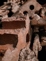 Close-up of stacked red refractory bricks showing texture and quality.