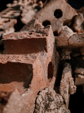 Close-up of stacked red refractory bricks showing texture and quality.
