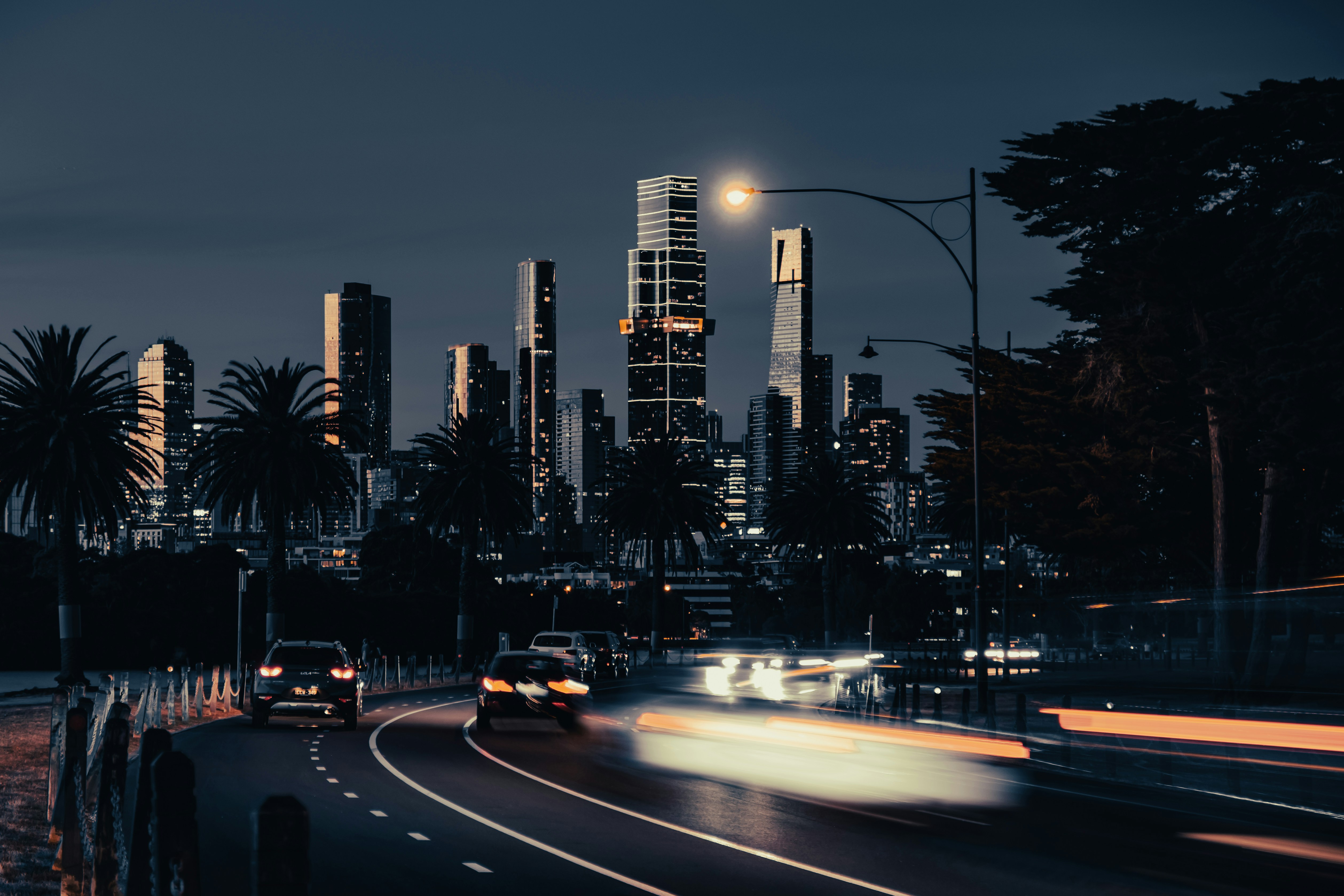 a city at night with a lot of traffic