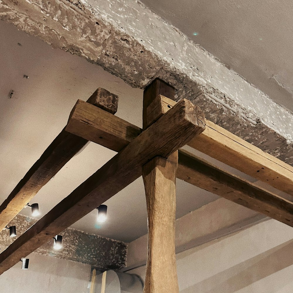 a wooden beam in the ceiling of a room