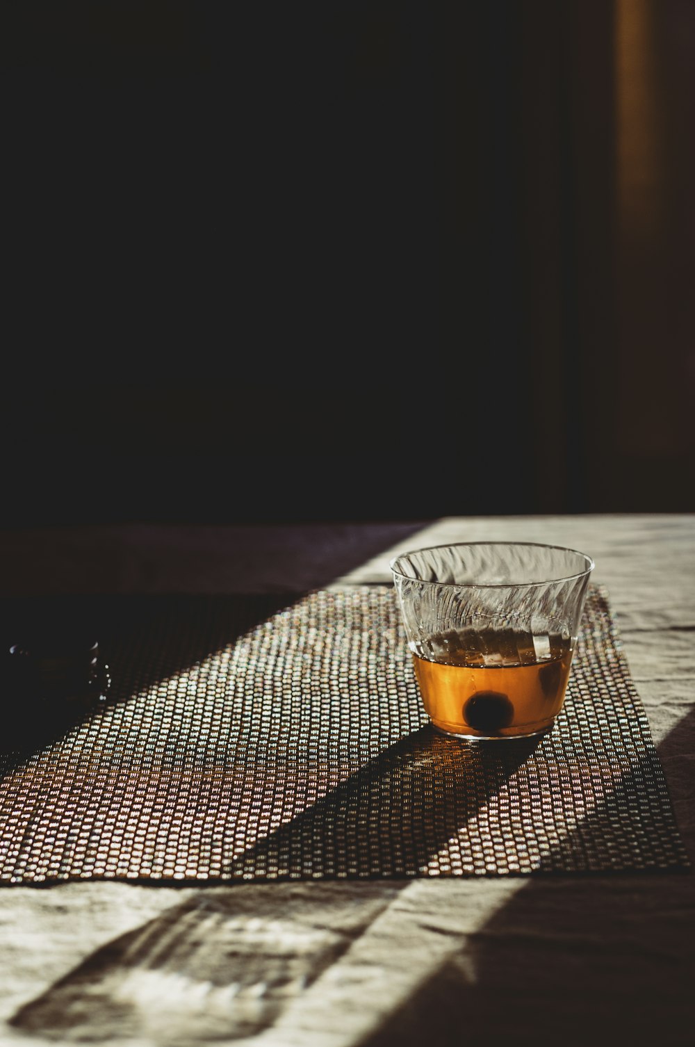 a glass bowl sitting on top of a wooden table