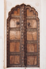 a large wooden door with intricate carvings on it