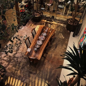 a wooden table and chairs in a room