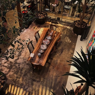 a wooden table and chairs in a room