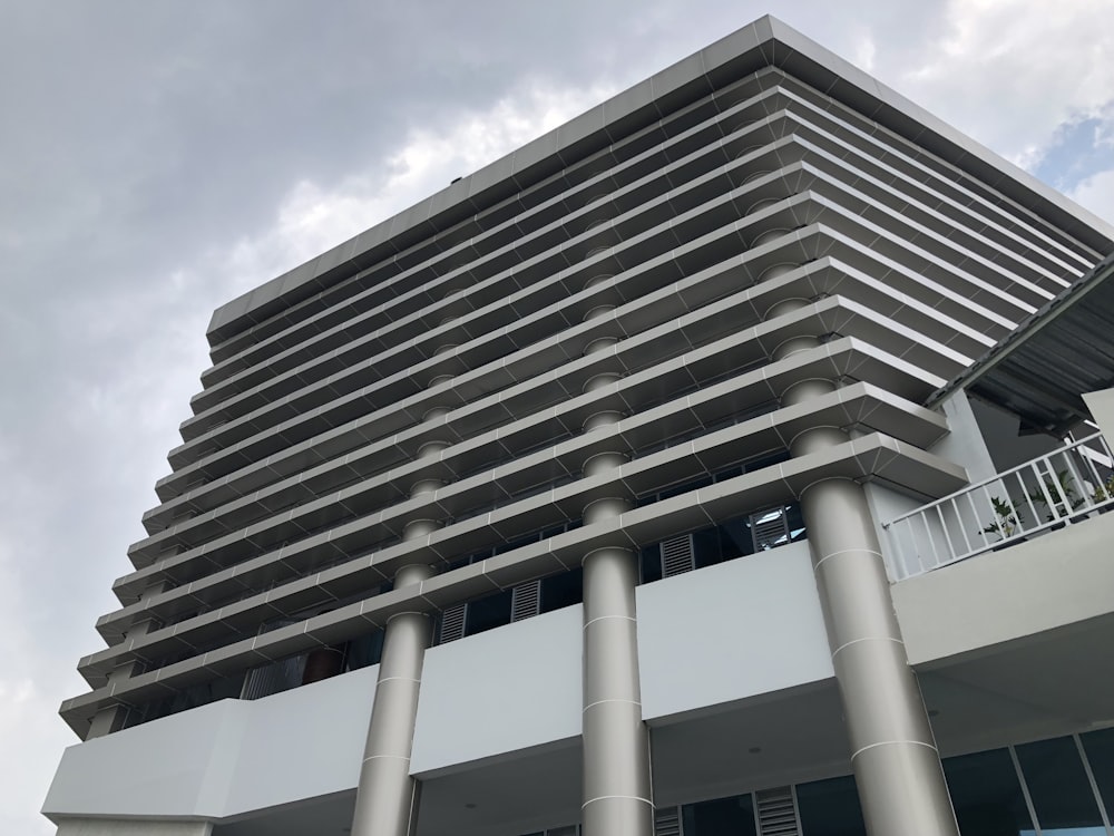 a very tall building with some columns in front of it