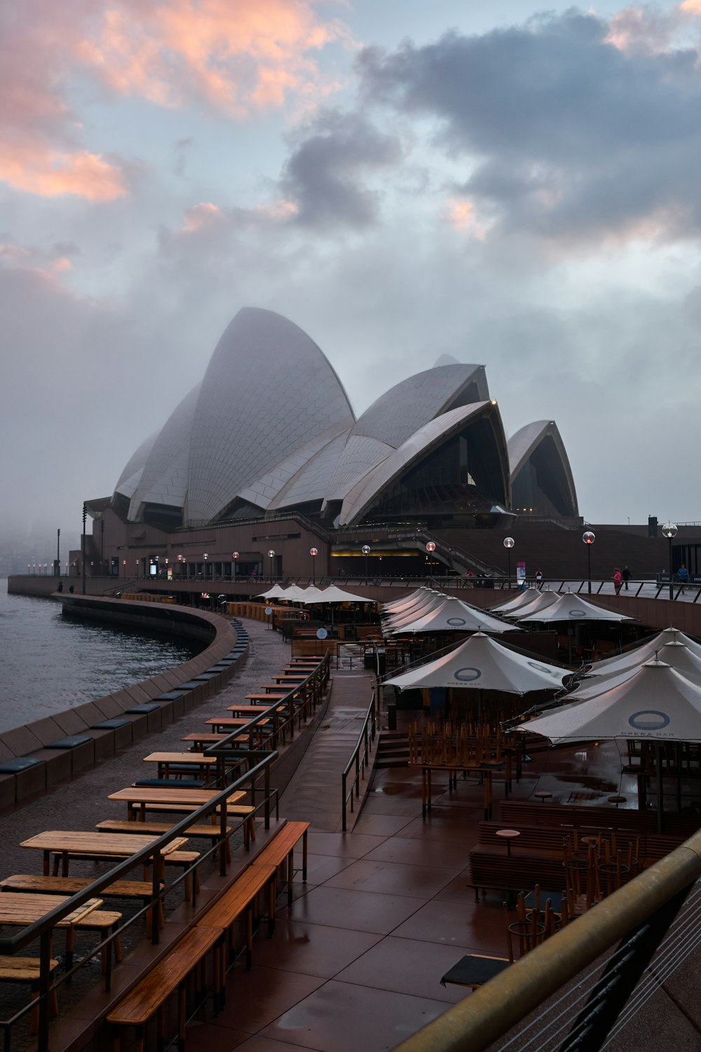 a view of the sydney opera house in the rain