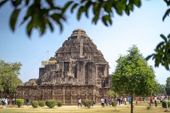 a group of people standing in front of a large building