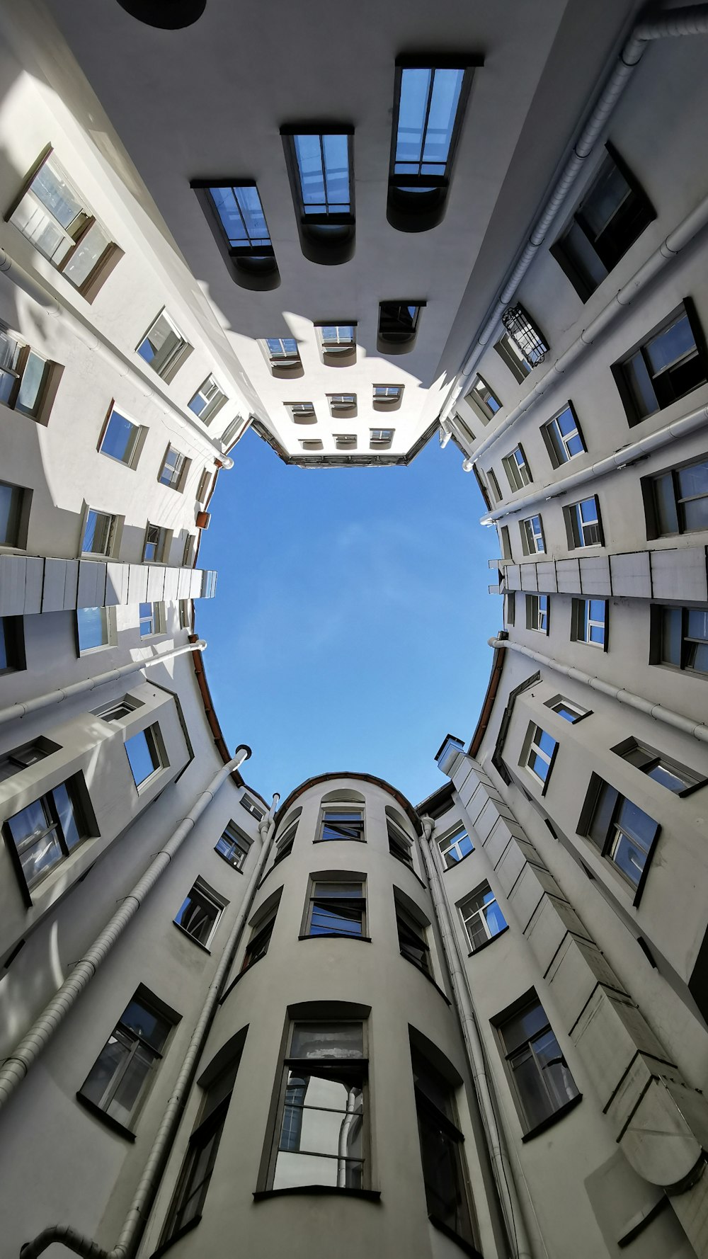 looking up at a tall building from the ground