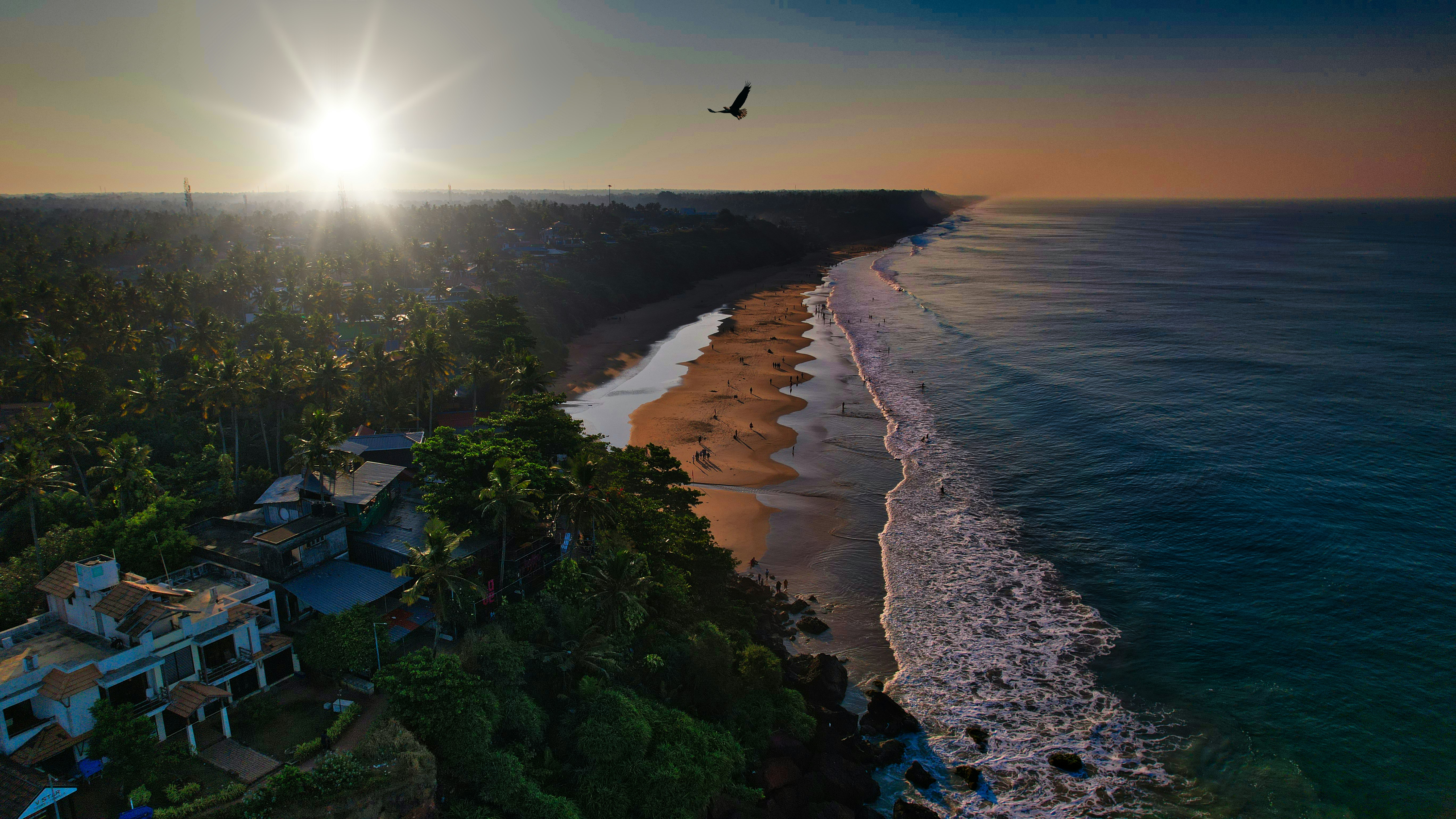 a sunset picture shot at Varkala Beach from above.