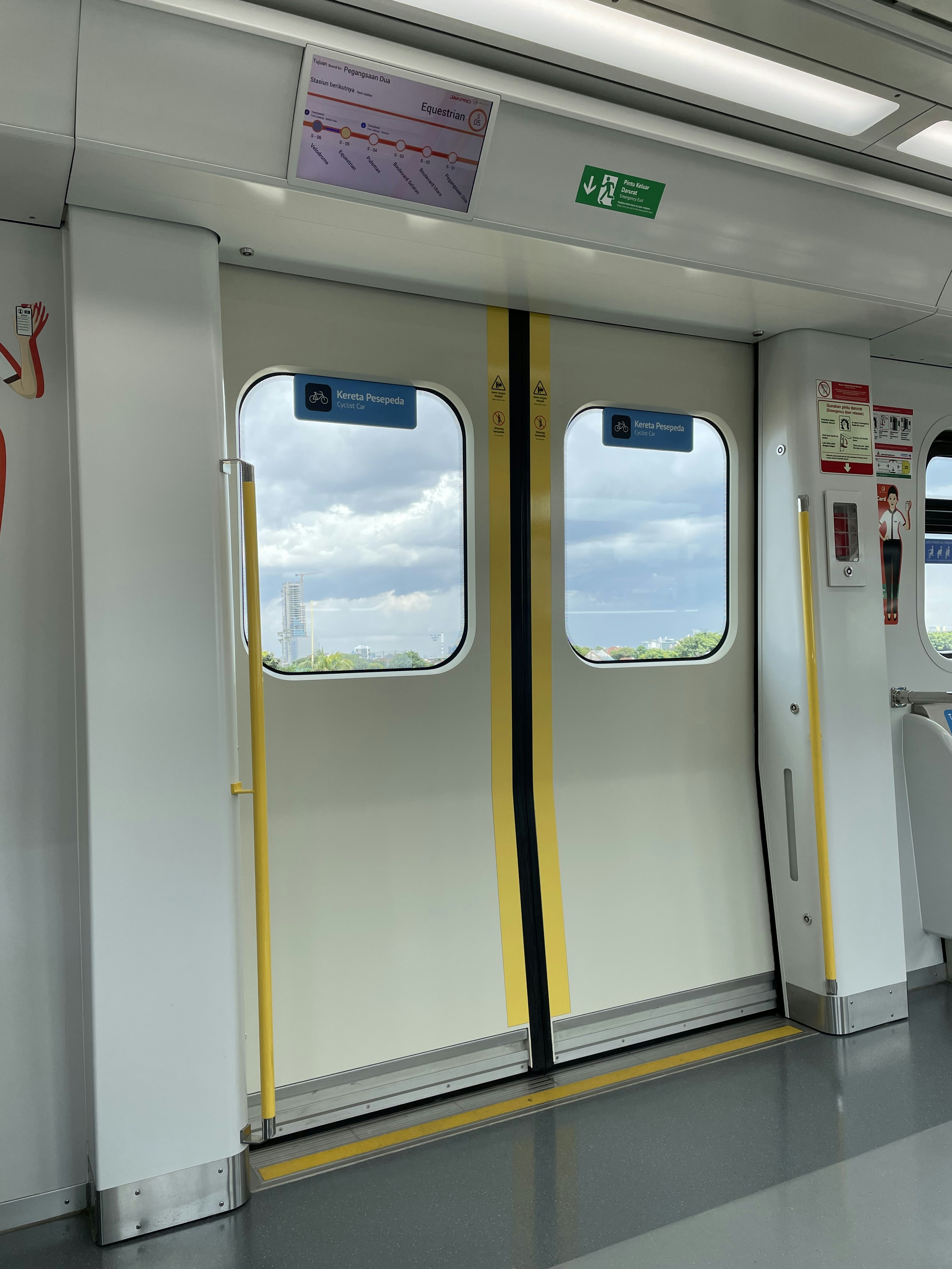 a train car with two windows and yellow trim