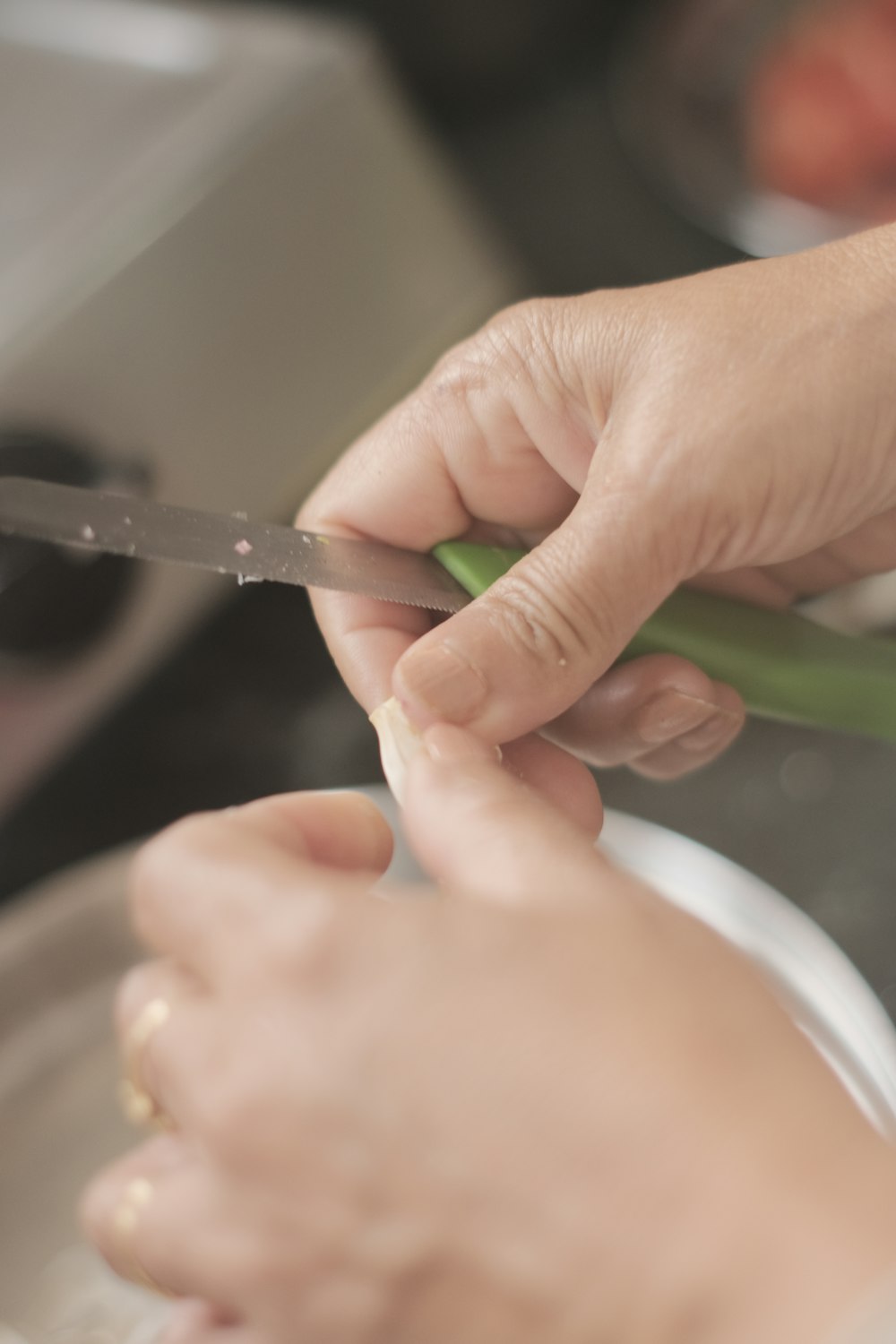 a close up of a person cutting something with a pair of scissors