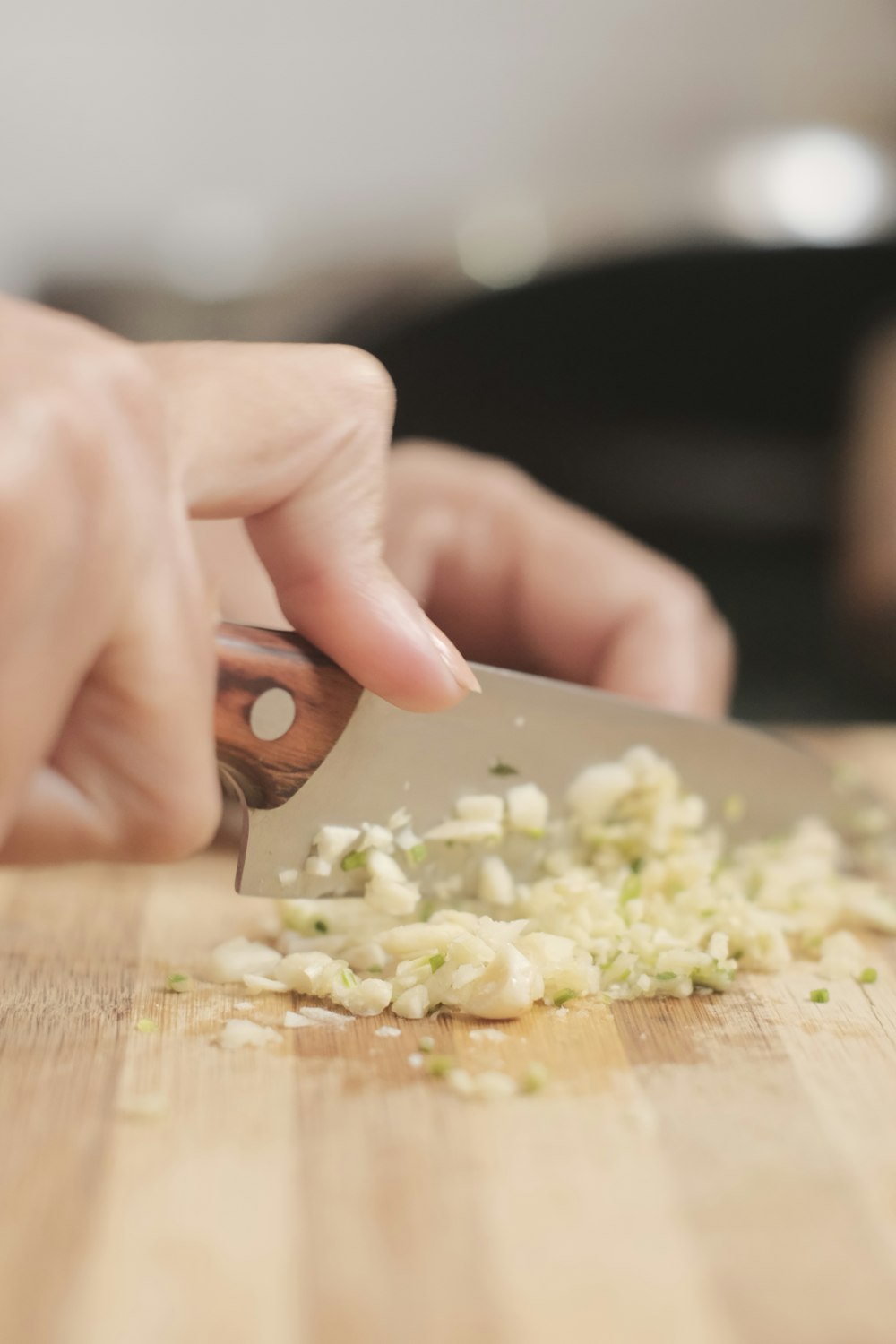 a person chopping onions on a cutting board