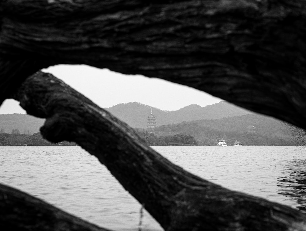 a black and white photo of a boat in the water