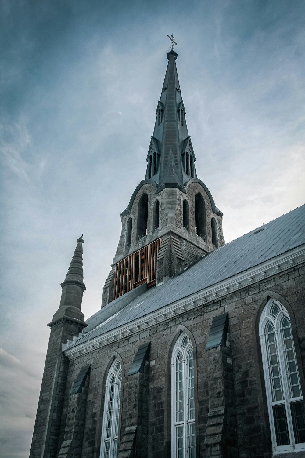 an old church with a steeple and windows