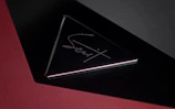 A sleek, minimalist certificate of authenticity displayed on black velvet.