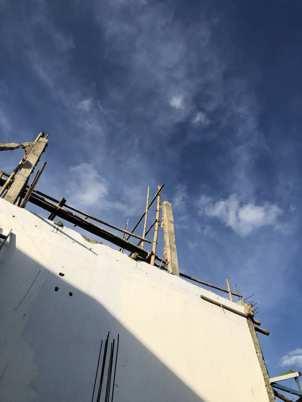 a building under construction under a blue sky