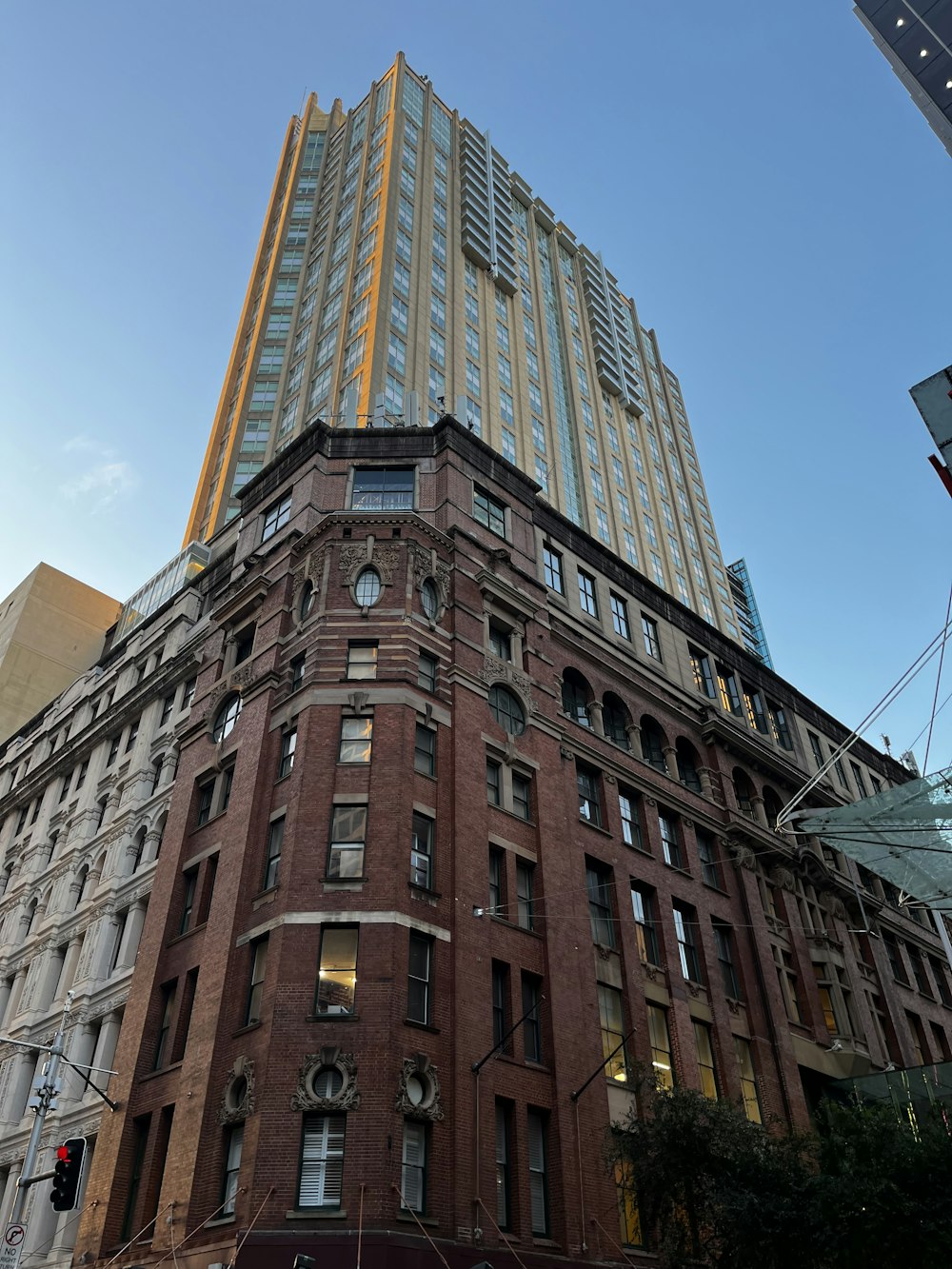 a very tall building sitting next to a traffic light