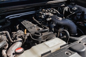 the engine compartment of a car with the hood open