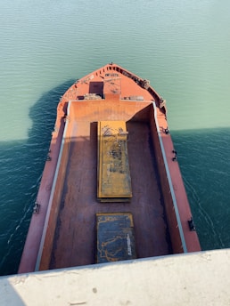A ship engineer inspecting the engine room of a large cargo vessel.