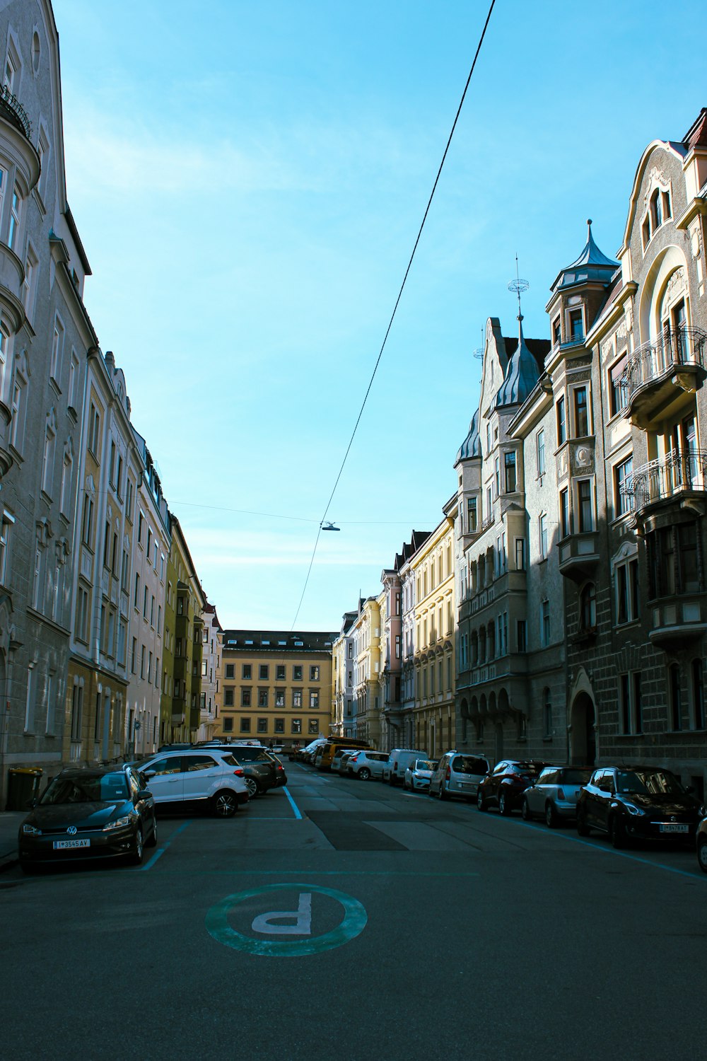 a street with cars parked on both sides of it