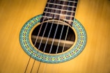 Close-up of a handcrafted classical guitar's rosette and soundhole.
