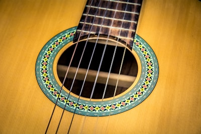 Close-up of a handcrafted classical guitar's rosette and soundhole.