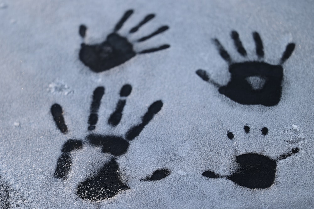 a couple of hand prints in the snow