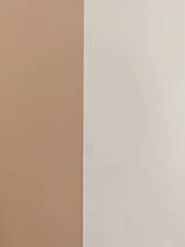 Close-up of a freshly painted white drywall corner in a home.