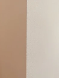 Close-up of a flawlessly finished drywall corner with a smooth, even texture.
