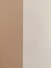 Close-up of a smooth, repaired drywall corner ready for painting.