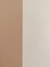 Close-up of smooth drywall seams ready for painting in a freshly renovated room.