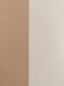 Close-up of freshly finished drywall corner with smooth texture in a modern home