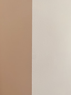 A close-up of freshly painted walls with crisp edges and smooth finish.