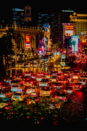 City street filled with traffic at night near the Las Vegas Strip, where locals face Grand Prix lane reductions through October 2026