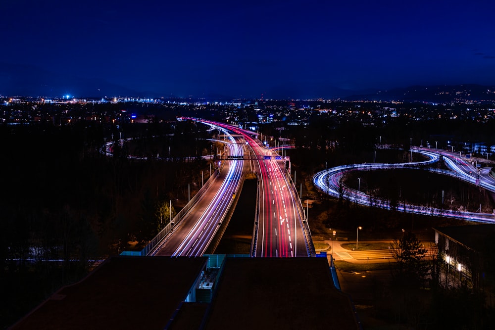 a night time view of a highway with lights