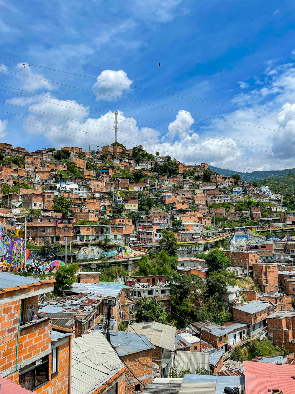 a view of a city with a hill in the background