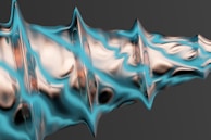 A flowing abstract form in bright turquoise and magenta, evoking movement and creative freedom.