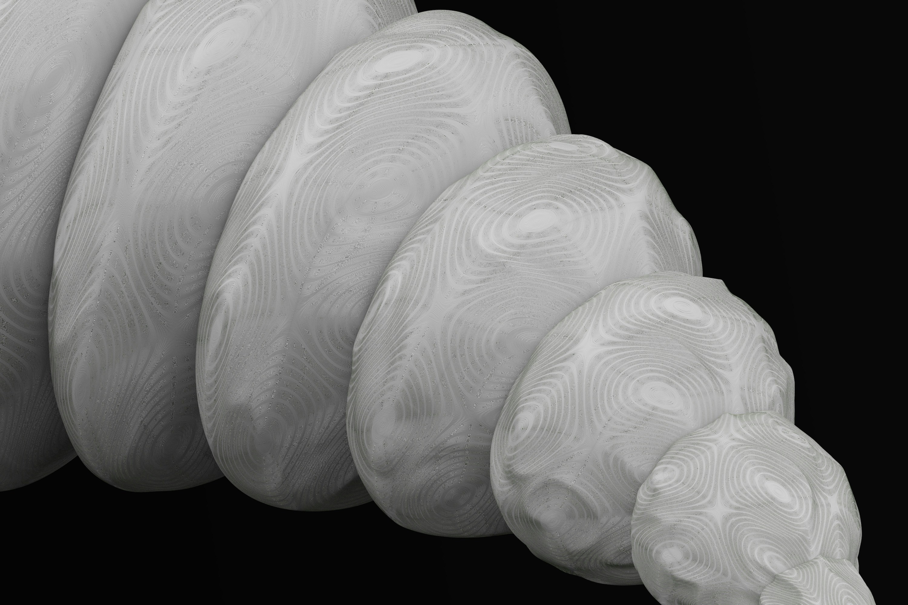 a close up of a white object on a black background