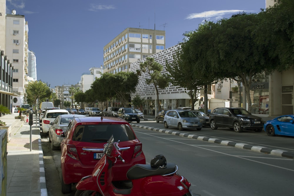 a red motorcycle parked on the side of a road