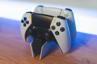 Various charging docks for game controllers displayed on a shelf.