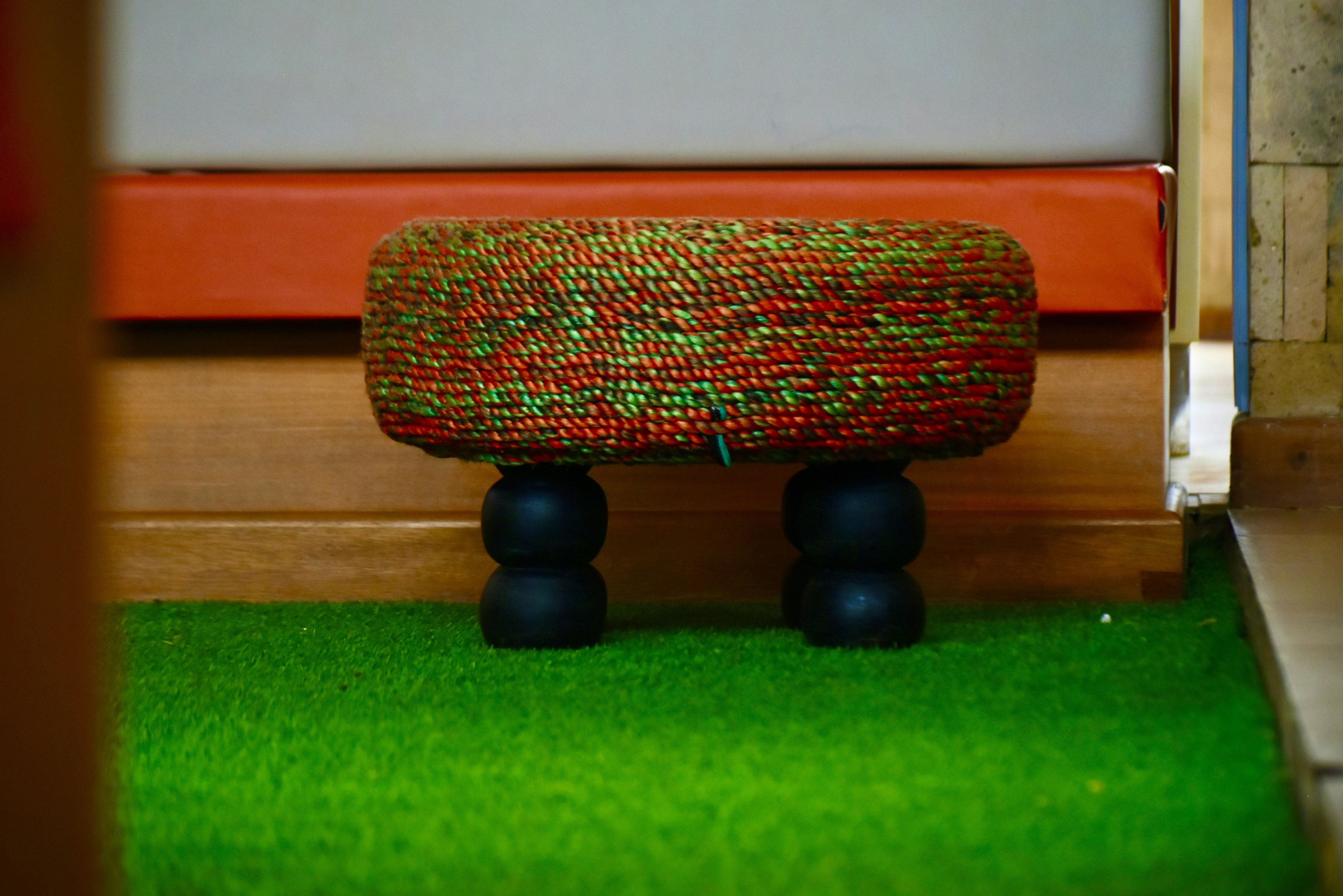 a bench sitting on top of a lush green field