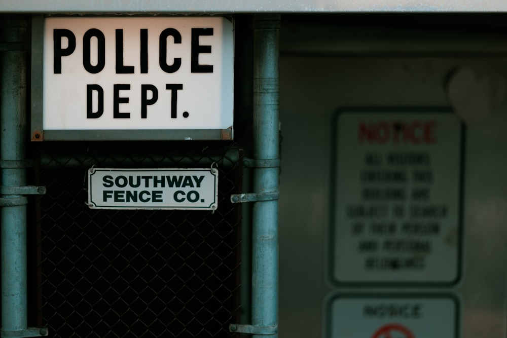 a sign that says police dept on the side of a building