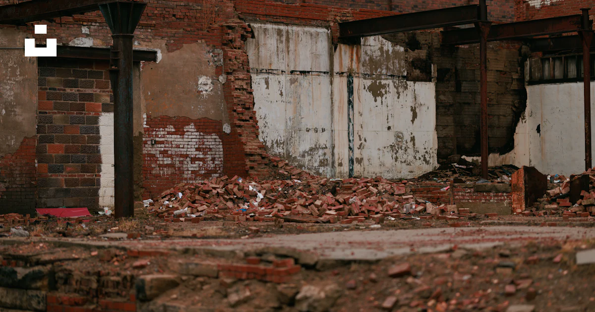 Random Building Rubble A building that has a bunch of rubble in front of it photo – Free Dirty ...
