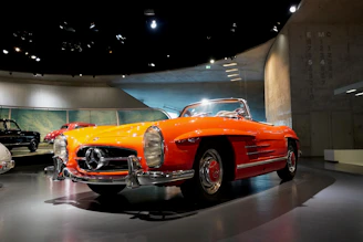 A sleek salvaged sedan ready for restoration under bright showroom lights