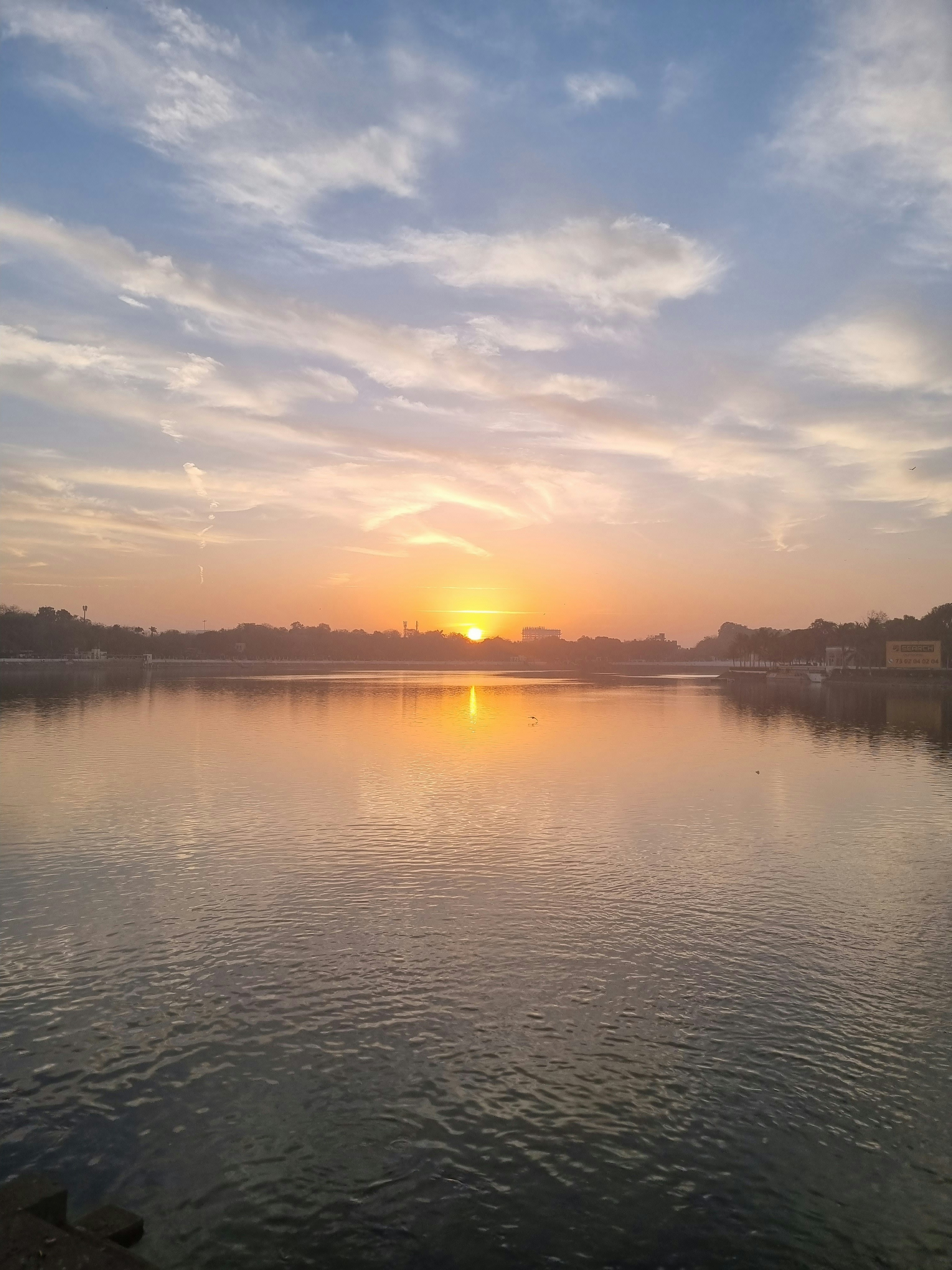 A serene sunrise over a calm lake, symbolizing new beginnings and personal growth.