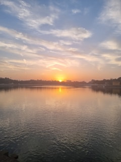 A serene sunrise over a calm ocean, symbolizing new beginnings and healing.